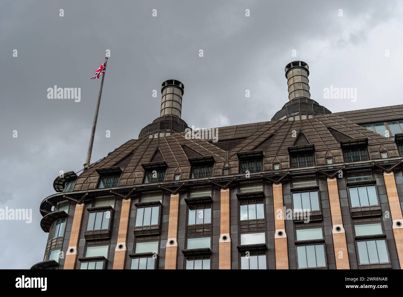 London, UK - August 26, 2023: Portcullis House in City of Westminster. Low angle view against cloudy sky Stock Photo