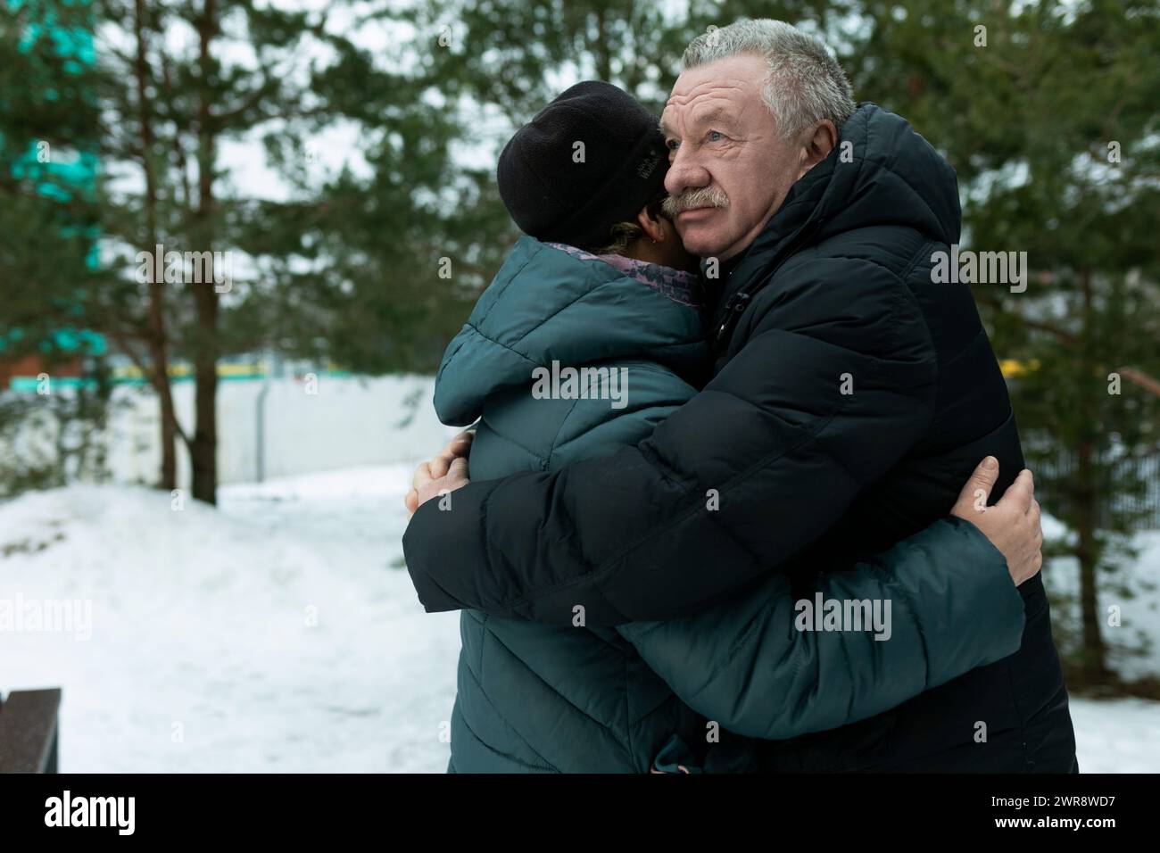 Happy elderly couple walking in the park and confessing their feelings ...
