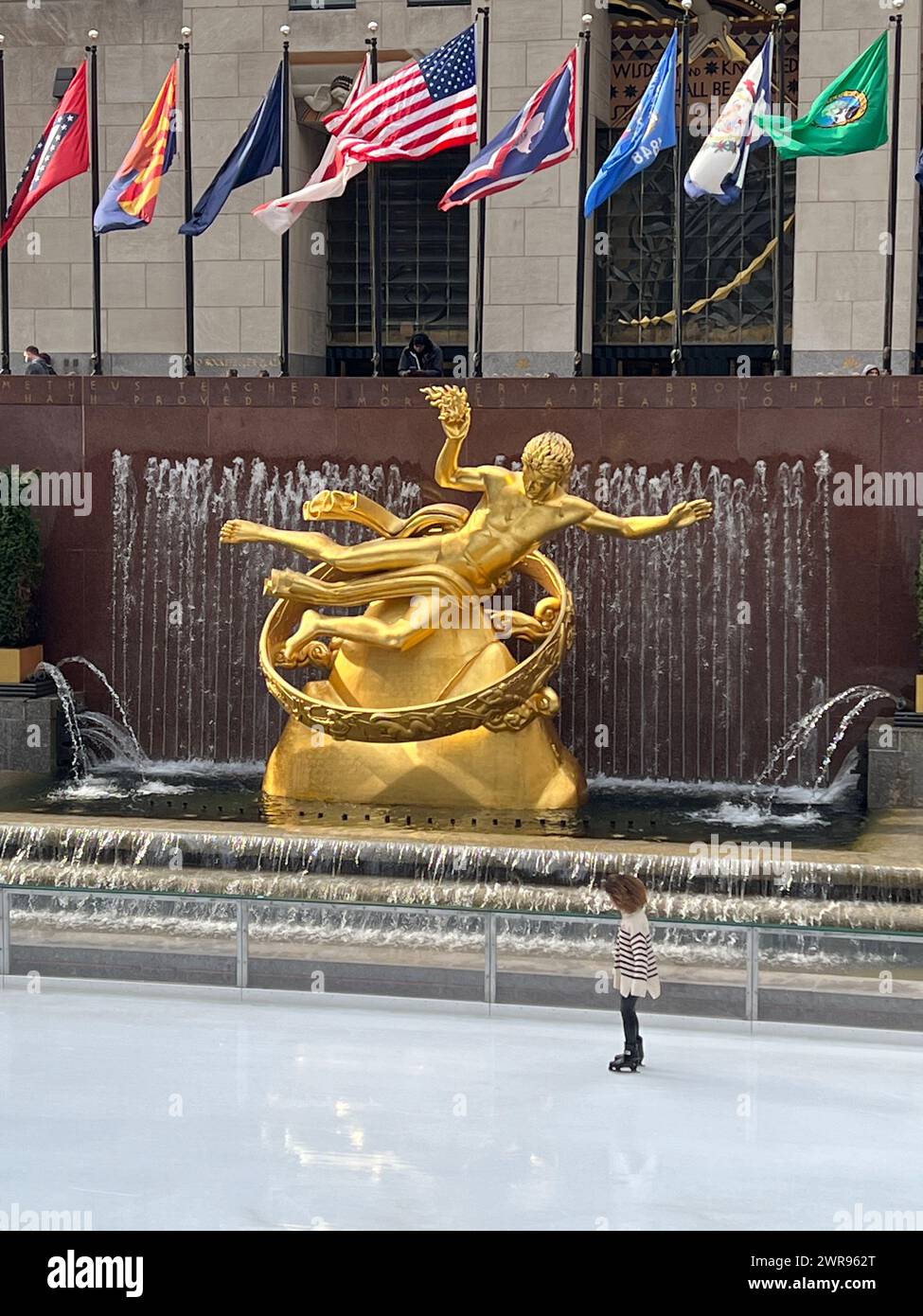 Prometheus, the 1934 gilded, cast bronze sculpture by Paul Manship,  located in Rockefeller Center at the skating rink. New York City. Stock Photo