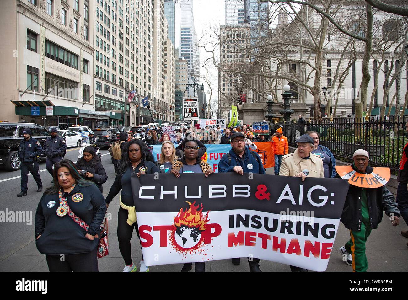 Environmental activists rally and march in New York City telling large insurance companies to stop insuring and supporting the big Fossil Fuel companies. Stock Photo