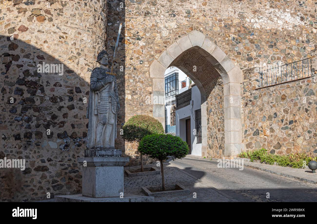 Castle archway with exterior wall statue Stock Photo