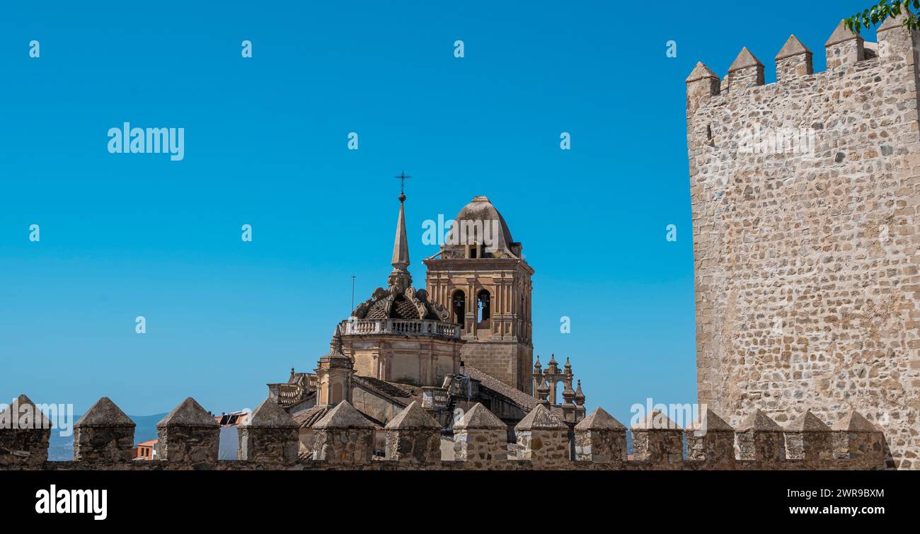 Ancient city wall tower featuring a clock Stock Photo