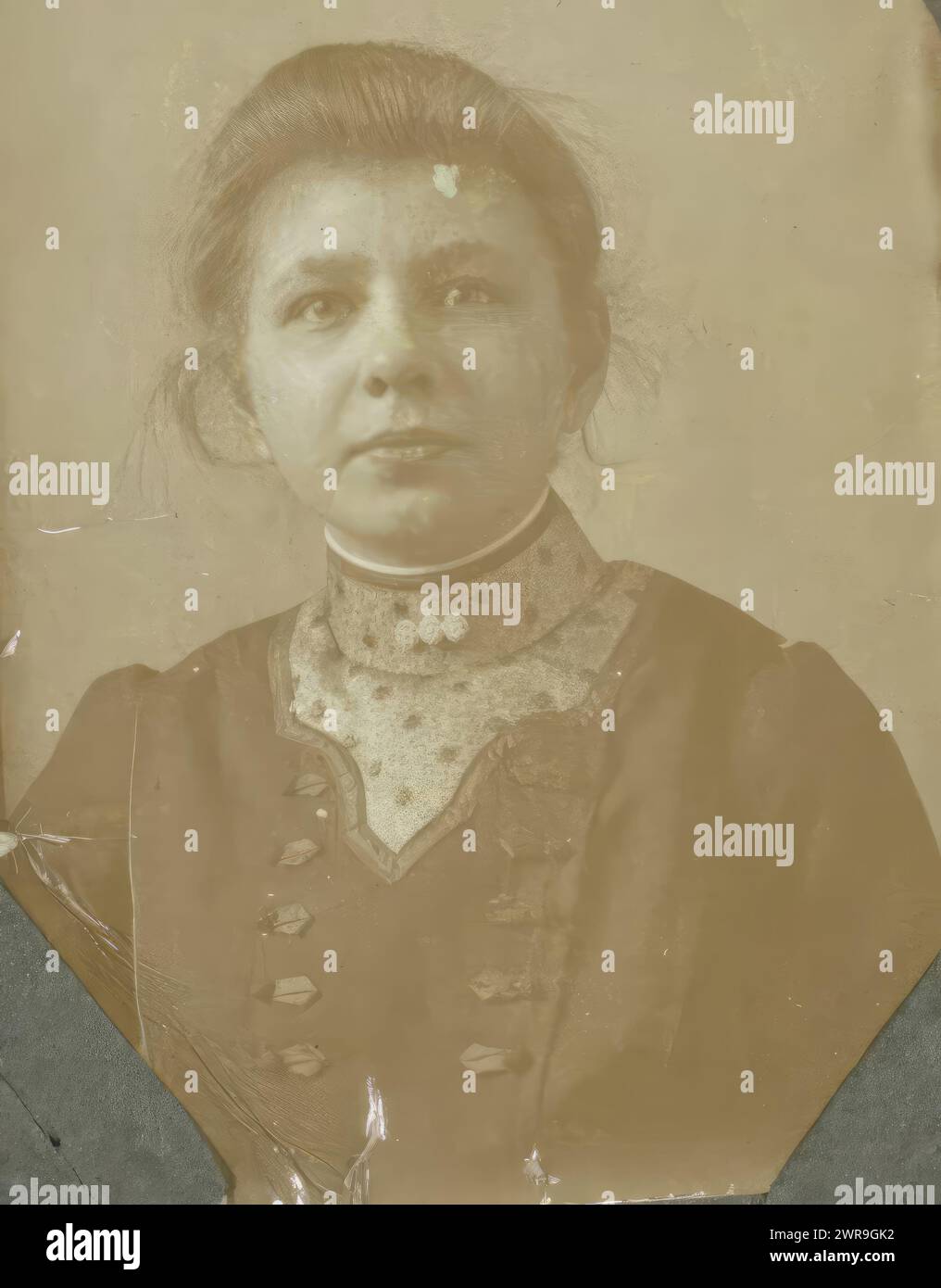 Portrait of a woman with updo hair, referred to as 'Aunt Sien', Part of Album with vending machine photos of a Dutch family., anonymous, Netherlands, c. 1910 - c. 1920, cardboard, gelatin silver print, height 40 mm × width 29 mm, photograph Stock Photo