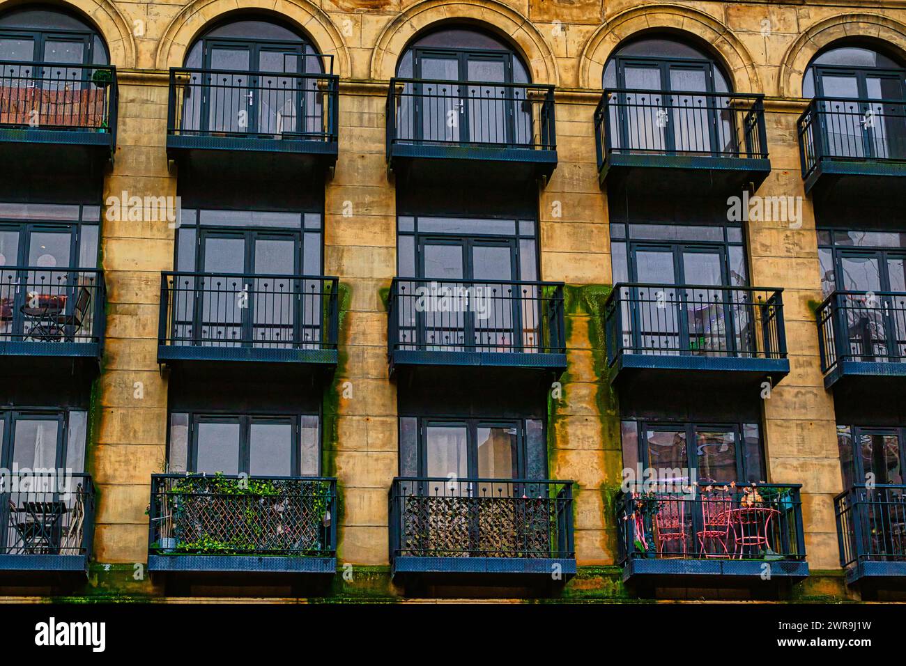 Facade of a vintage building with ornate windows and balconies in Leeds ...