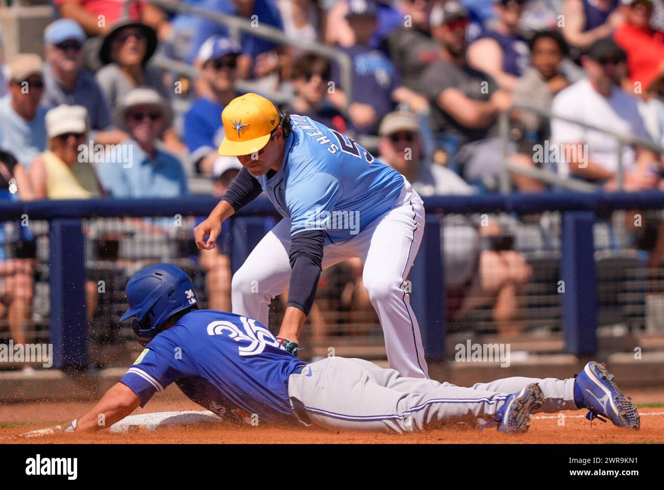 Toronto Blue Jays Davis Schneider (36) reaches third base on a fly out