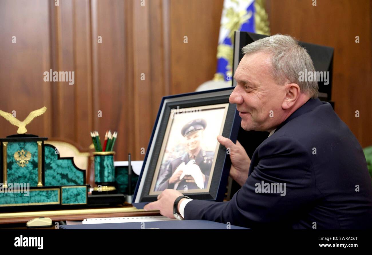 Moscow, Russia. 11th Mar, 2024. Russian state space agency Roscosmos Director General Yury Borisov shows a photo of the first man in space, Yury Gagarin, to Russian President Vladimir Putin, during a meeting at the Kremlin, March 11, 2024 in Moscow, Russia. This year marks the 90th birthday anniversary of cosmonaut Yury Gagarin. Credit: Mikhail Metzel/Kremlin Pool/Alamy Live News Stock Photo
