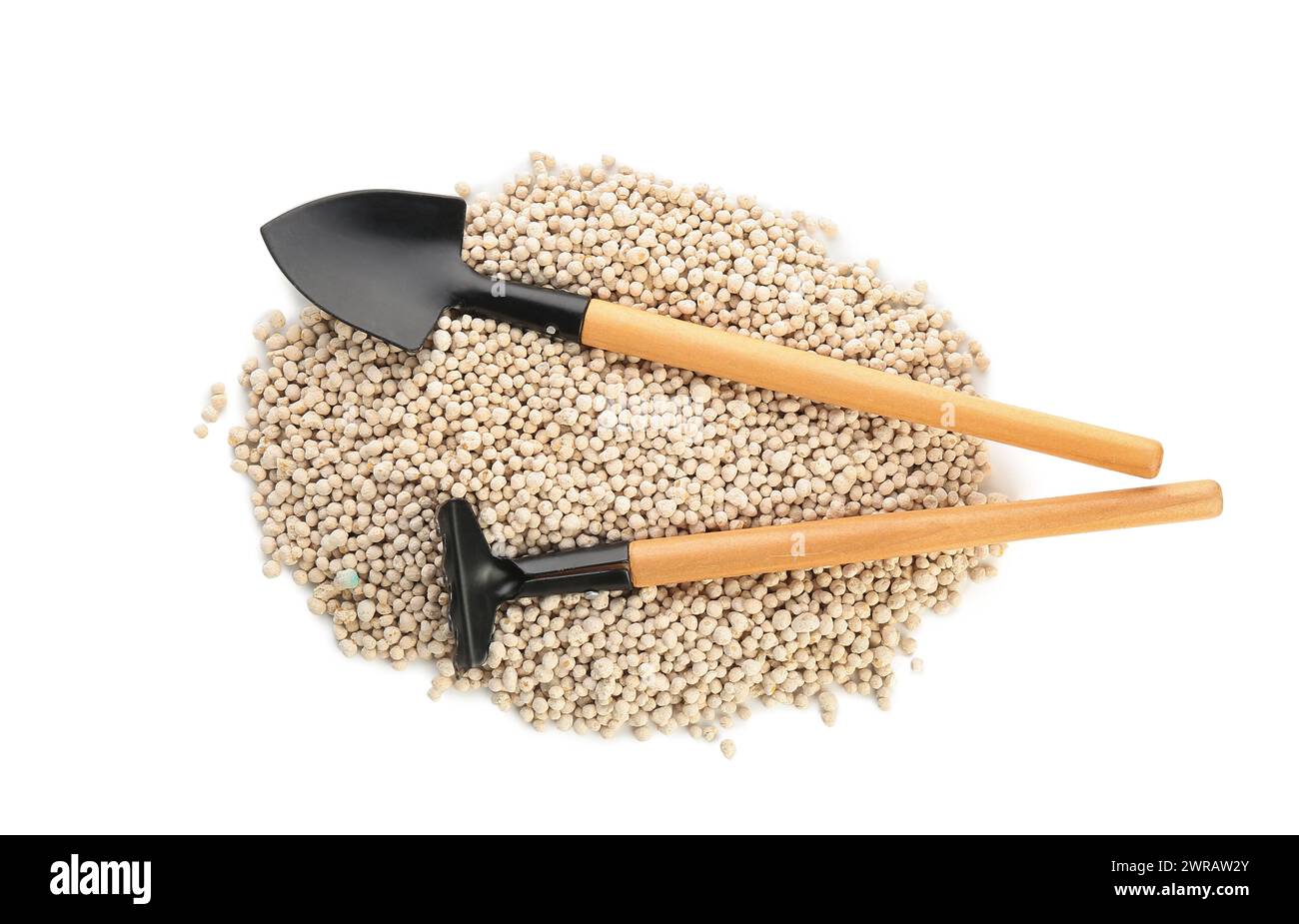 Gardening shovel and rake with granular fertilizer isolated on white ...