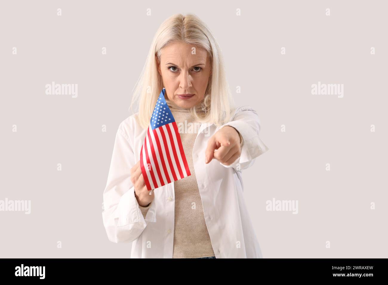 Mature woman pointing viewer hi-res stock photography and images - Alamy