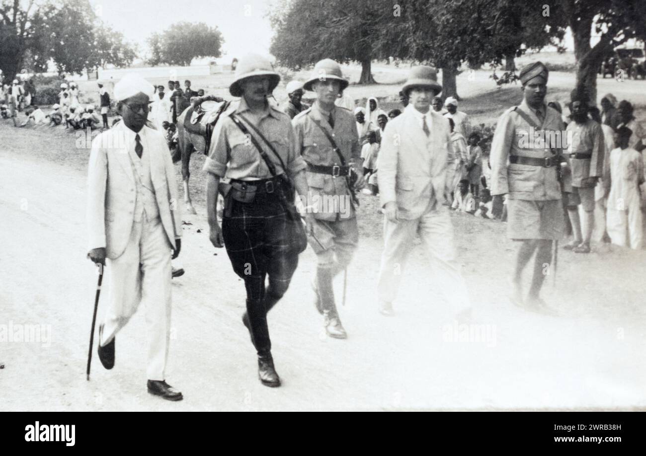 A Major in the 2nd Battalion Highland Light Infantry receiving a civic welcome with other officers and cvilians in British India, c. 1925. Stock Photo