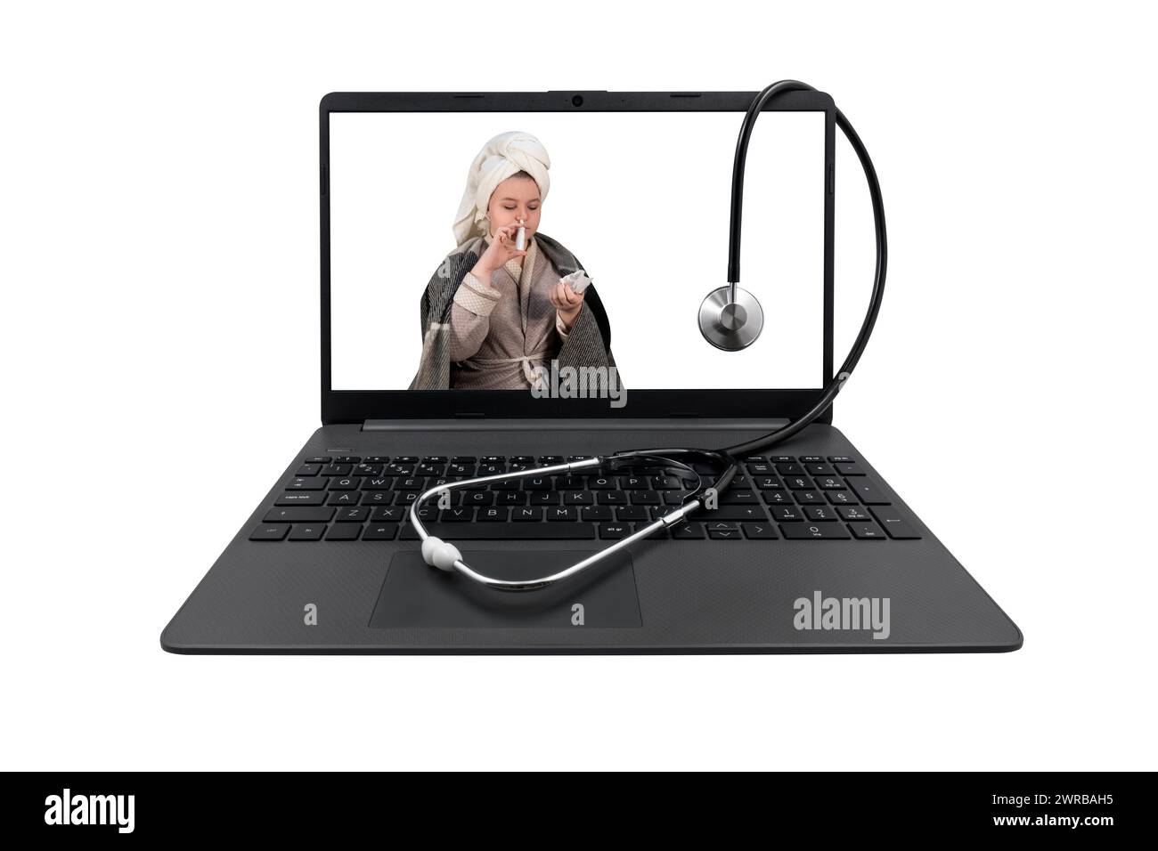 Laptop and medical stethoscope isolated on white background. On the laptop screen - a girl with cold symptoms injects a spray into her nose Stock Photo