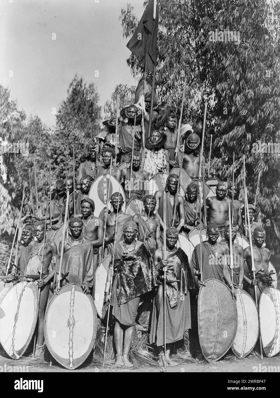 Group of Kavirondo natives posed in standing pyramid with spears and shields. ca. 191-, in Africa, Carpenter, Frank G. (Frank George), 1855-1924, collector, between 1910 and 1920, Warriors, Africa, 1910-1920, Group portraits, 1910-1920., Portrait photographs, 1910-1920, Group portraits, 1910-1920, 1 photographic print Stock Photo
