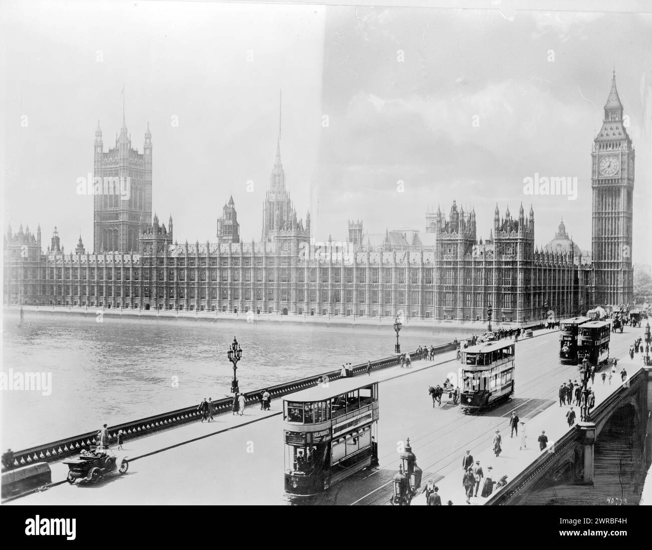 England - London - Parliament looking across bridge, Photo shows a view of the Westminster Bridge with double-decker buses or trolleys and pedestrians in the foreground, and the House of Parliament and Big Ben in the background., between 1915 and 1923, Great Britain., Parliament, Buildings, 1910-1930, Photographic prints, 1910-1930., Photographic prints, 1910-1930, 1 photographic print Stock Photo