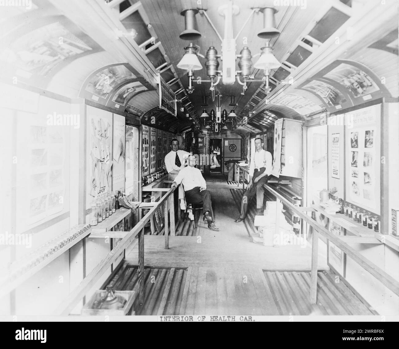Interior of health car, Three men in a railroad car., between ca. 1910 and 1925, Health care facilities, 1910-1930, Photographic. prints, 1910-1930., Photographic. prints, 1910-1930, 1 photographic. print Stock Photo