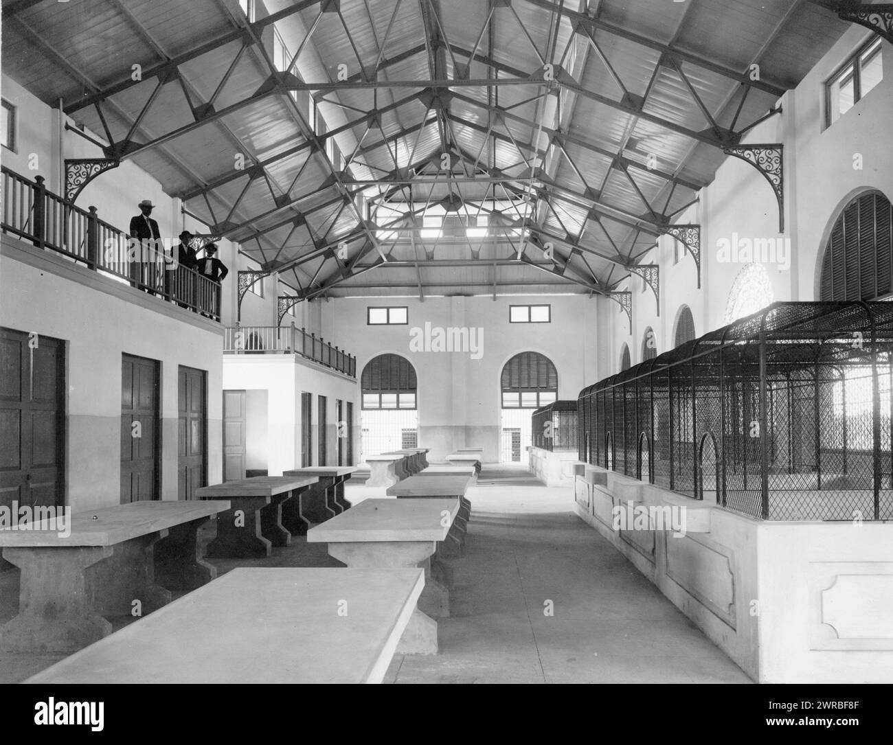 New public market, San Juan, Puerto Rico, Interior view of new building, empty except for three men observing from gallery., between ca. 1890 and 1923, Markets, Puerto Rico, San Juan, 1890-1930, Photographic prints, 1890-1930., Photographic prints, 1890-1930, 1 photographic print Stock Photo