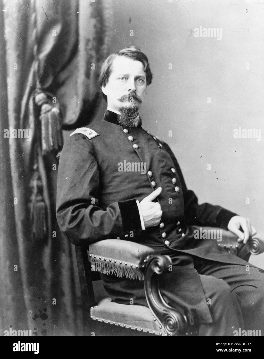 Major General Winfield S. Hancock, three-quarter length portrait, seated, facing front, Washington, D.C.: Campbell Photo Service, between 1861 and 1865, Hancock, Winfield Scott, 1824-1886, Military service, Photographic prints, 1860-1870., Portrait photographs, 1860-1870, Photographic prints, 1860-1870, 1 photographic print Stock Photo