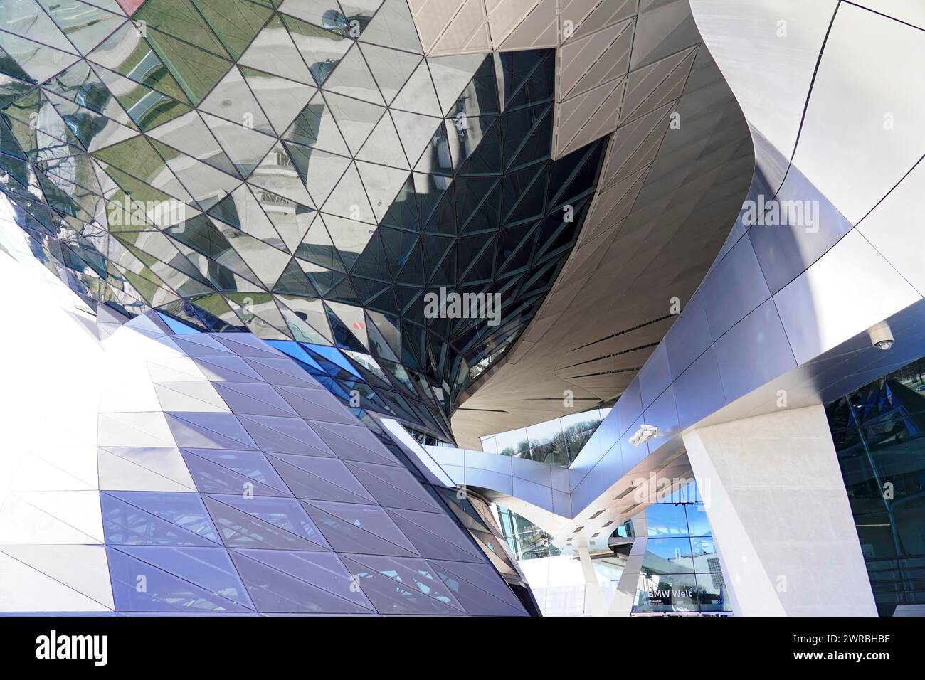 View of a complex glass shell of a building with fascinating reflections and shapes, BMW WELT, Munich, Germany Stock Photo