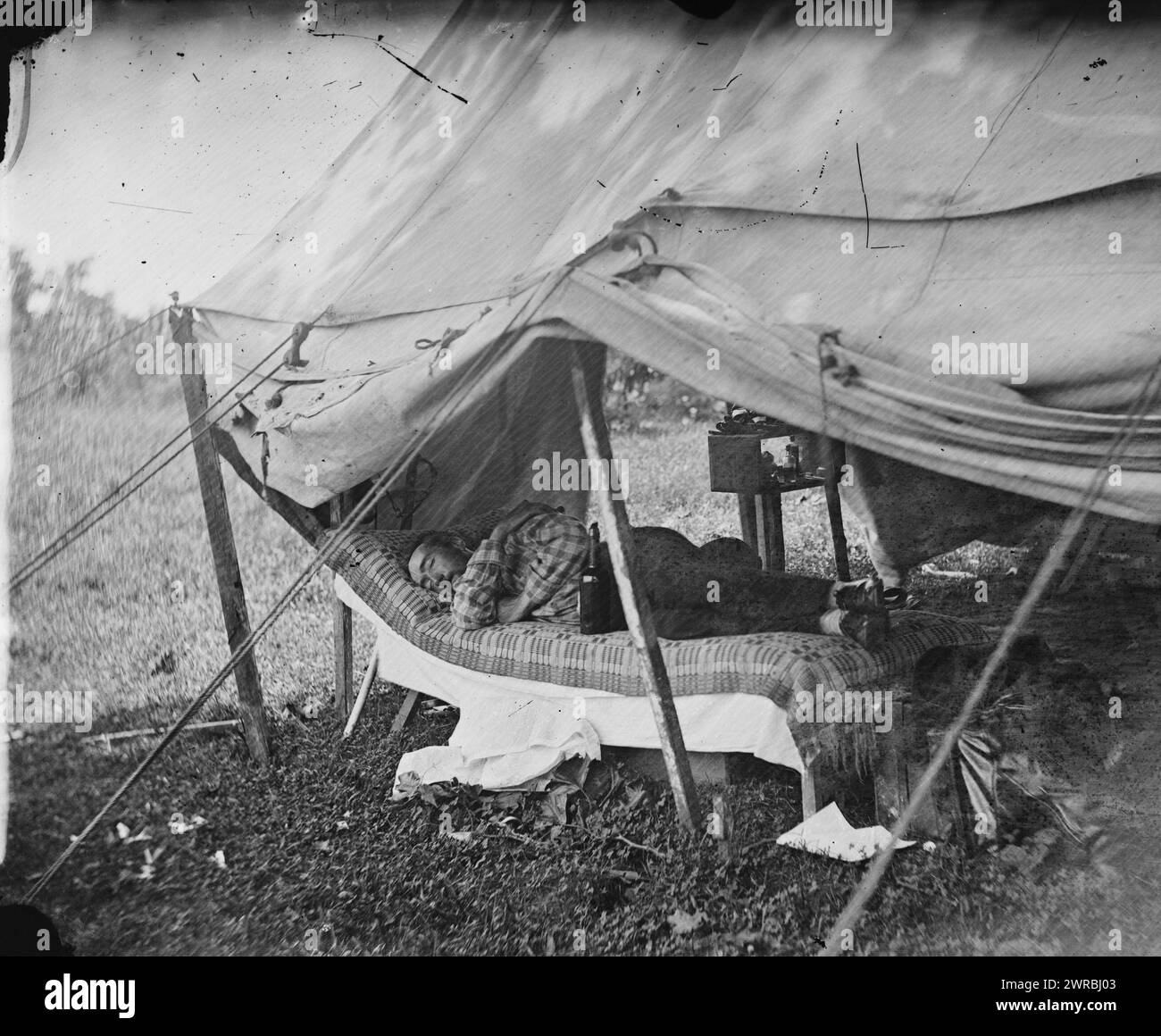 Westover Landing, Va. Lt. Col. Samuel W. Owen, 3d Pennsylvania Cavalry, caught napping, Photograph from the main eastern theater of war, the Peninsular Campaign, May-August 1862., Gardner, Alexander, 1821-1882, photographer, 1862 August., United States., Army., Pennsylvania Cavalry Regiment, 3rd (1861-1865), Glass negatives, 1860-1870, Stereographs, 1860-1870, 1 negative: glass, stereograph, wet collodion, 4 x 10 in Stock Photo