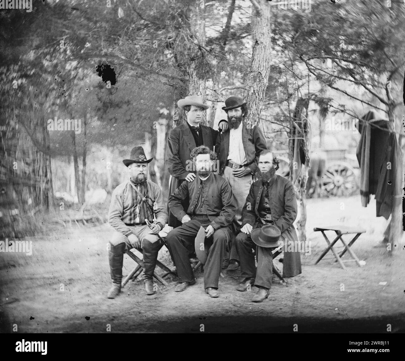 Harrison's Landing, Va. Group of the Irish Brigade, Photo shows: (back row) Patrick Dillon, unidentified; and (front row, left to right) unidentified, James Dillon, and William Corby. The identified men are priests of the Congregation of the Holy Cross, University of Notre Dame., Photograph from the main eastern theater of war, the Peninsular Campaign, May-August 1862., Gardner, Alexander, 1821-1882, photographer, 1862 July., United States, History, Civil War, 1861-1865, Military personnel, Glass negatives, 1860-1870, Stereographs, 1860-1870, 1 negative: glass, stereograph, wet collodion Stock Photo