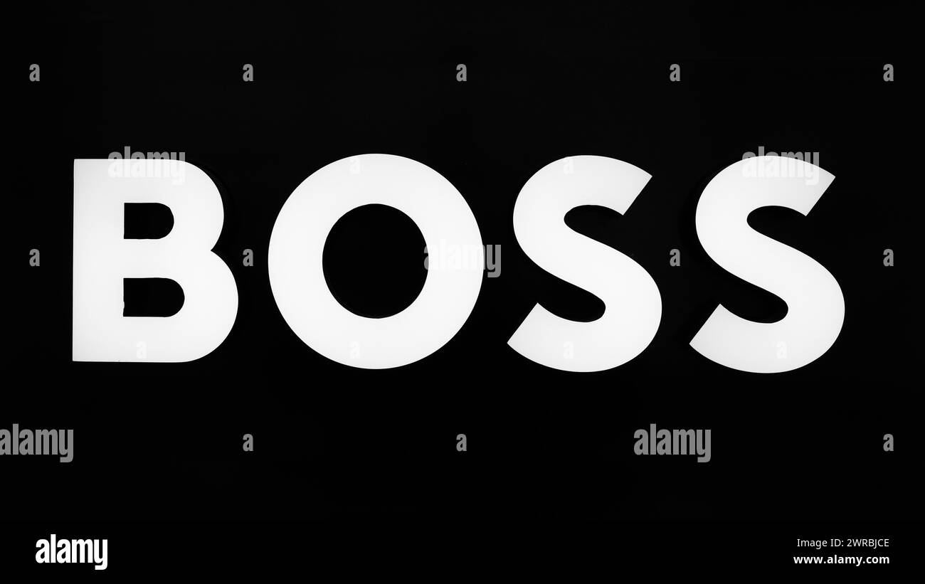 Boss brand lettering, black and white, Roermond, Netherlands Stock Photo