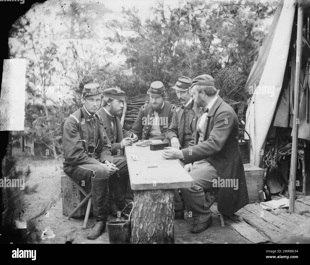 Yorktown, Va., vicinity. Duc de Chartres, Comte de Paris, Prince de Joinville, and friends playing dominoes at a mess table, Camp Winfield Scott, Photograph from the main eastern theater of war, the Peninsular Campaign, May-August 1862., Gibson, James F., 1828-, photographer, 1862 May., United States, History, Civil War, 1861-1865, Military life, Stereographs, 1860-1870., Stereographs, 1860-1870, Wet collodion negatives, 1 negative (2 plates): glass, stereograph, wet collodion Stock Photo