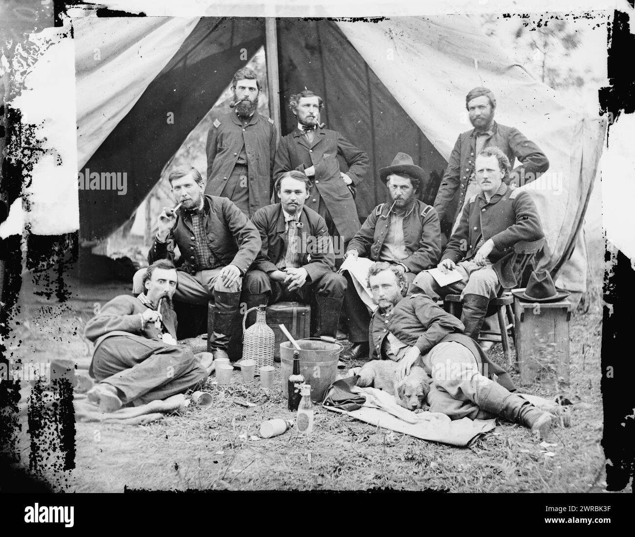 The Peninsula, Va. The staff of Gen. Fitz-John Porter; Lts. William G. Jones and George A. Custer reclining, Photograph from the main eastern theater of war, the Peninsular Campaign, May-August 1862., Gibson, James F., 1828-, photographer, 1862 May 20., United States, History, Civil War, 1861-1865, Stereographs, 1860-1870., Stereographs, 1860-1870, Wet collodion negatives, 1 negative (2 plates): glass, stereograph, wet collodion Stock Photo