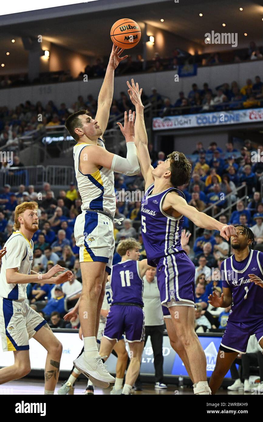 South Dakota State Jackrabbits forward Luke Appel (13) shoots over defender St. Thomas - Minnesota Tommies forward Parker Bjorklund (5) during an NCAA men's basketball semi-final between the University of St. Thomas-Minnesota Tommies and the South Dakota State Jackrabbits during the Summit League Championships at the Denny Sanford PREMIERE Center in Sioux Falls, SD on Monday, March 11, 2024. Russell Hons/CSM Stock Photo