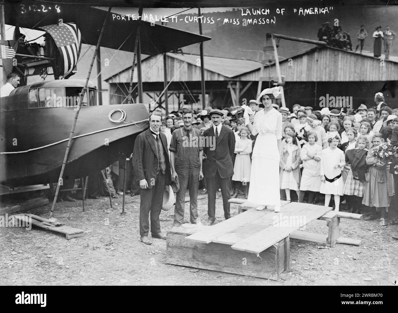 Porte, Hallett, Curtiss, Miss Masson, at launch of 'America', Photograph shows the christening and launch of the Curtiss Model H Flying Boat airplane 'America' on June 22, 1914 in Hammondsport, New York. From left to right, aviators John Cyril Porte, George E.A. Hallett, builder Glenn Curtiss and Katherine Masson., 1914 June 22, Glass negatives, 1 negative: glass Stock Photo