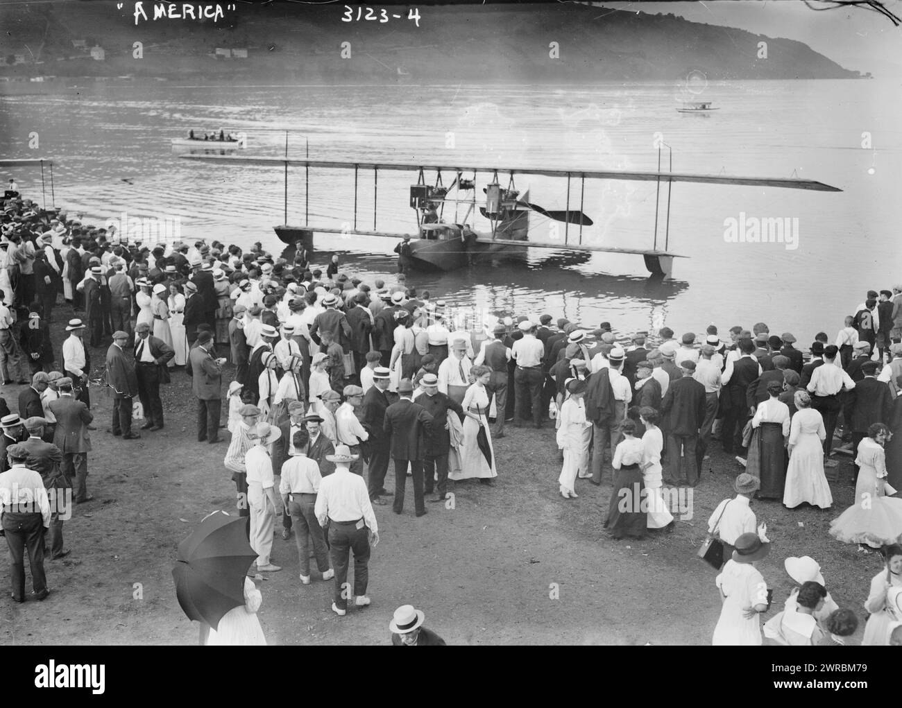 AMERICA', Photograph shows the christening and launch of the Curtiss Model H Flying Boat airplane 'America' on June 22, 1914 in Hammondsport, New York. From left to right, aviators John Cyril Porte, George E.A. Hallett, builder Glenn Curtiss and Katherine Masson., 1914 June 22, Glass negatives, 1 negative: glass Stock Photo