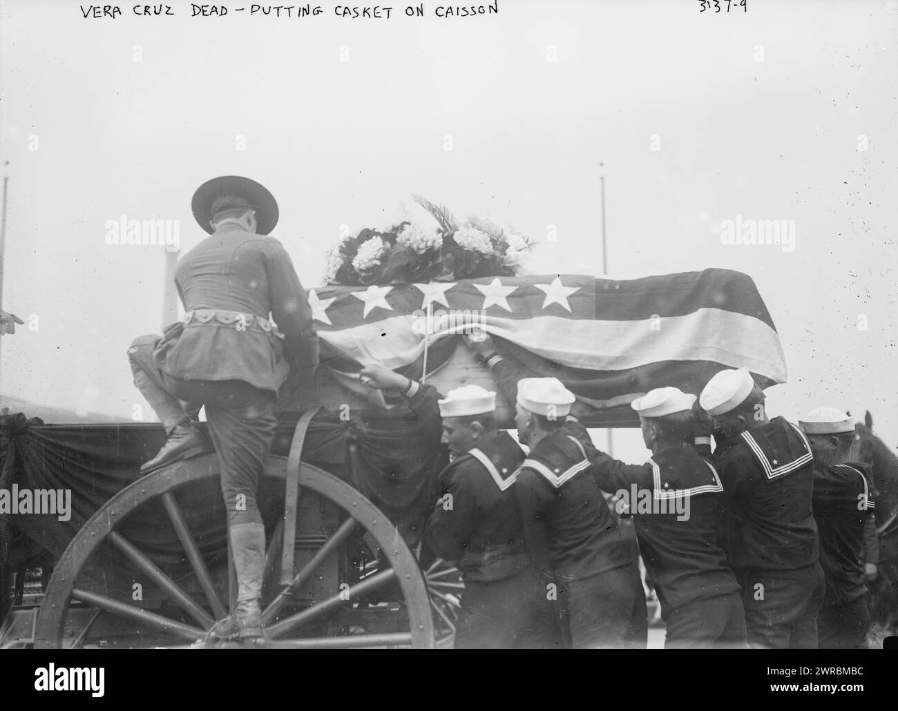 Vera Cruz dead, putting casket on caisson, Photograph shows soldier and