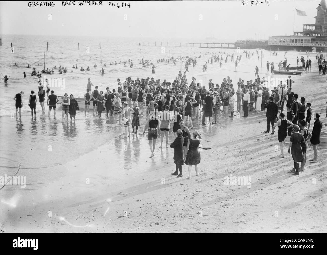 Greeting race winner, 7/16/14, Photograph shows a women's swimming contest, Sheepshead Bay, Brooklyn, New York which was held on July 16, 1914., 7/16/14, Glass negatives, 1 negative: glass Stock Photo