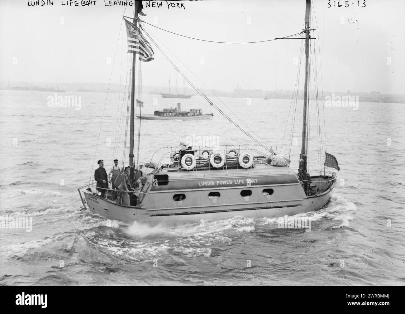 Lundin lifeboat leaving N.Y., Photograph shows the Lundin Power Lifeboat with newlyweds Einar Sivard and Signe Holm Sivard and crew, leaving New York City for a trip to cross the Atlantic. Sivard was Superintendent of the Welin Manufacturing Co. which built the Lundin lifeboats., 1914 July, Glass negatives, 1 negative: glass Stock Photo