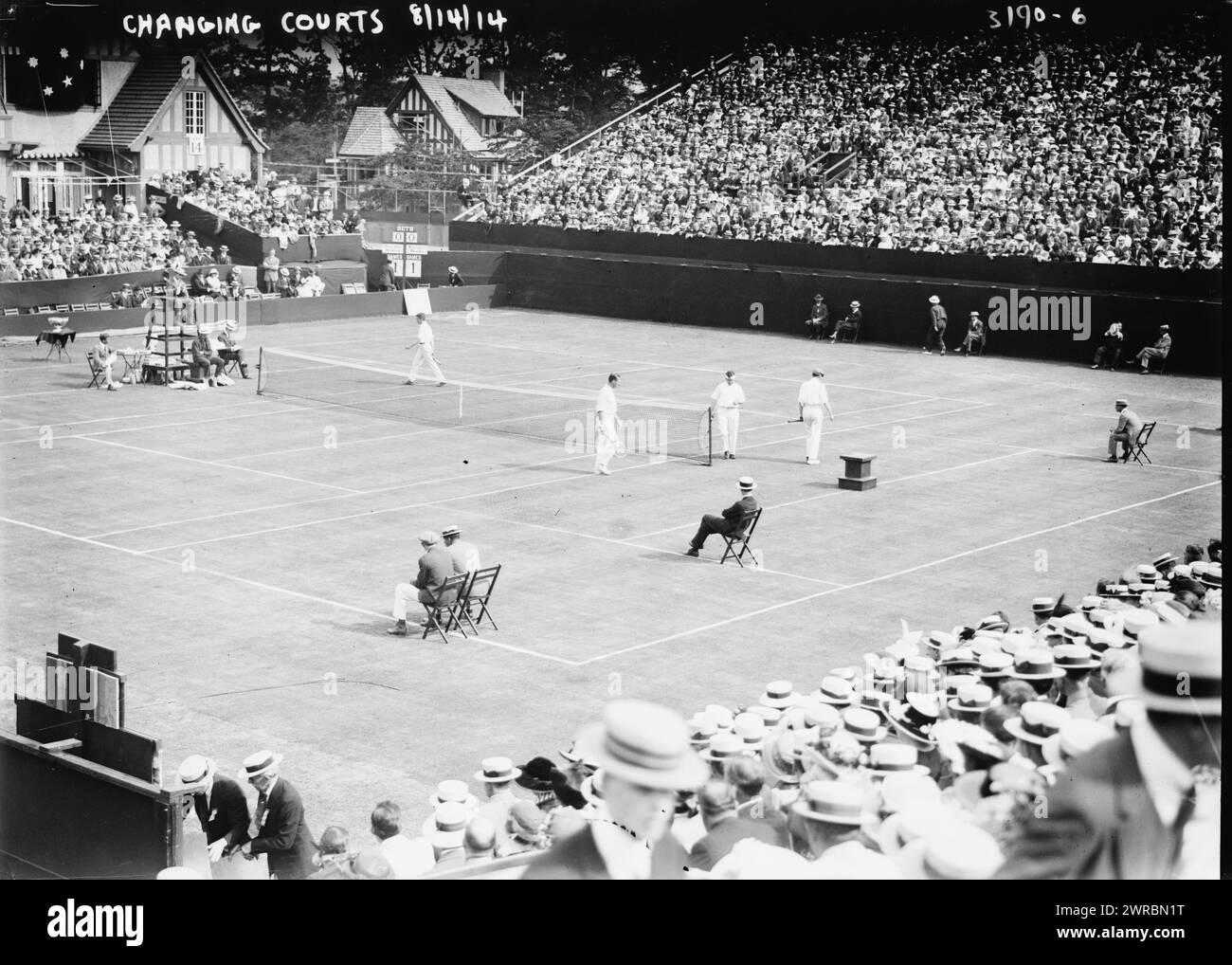 Changing Courts, 8/14/14 (Tennis), Photograph shows the Davis Cup Match between the American team (Maurice E. McLoughlin and Thomas A. Bundy) and the Australian team (Anthony F. Wilding and Norman E. Brookes) at the West Side Tennis Club, Forest Hills, Long Island, New York. The Davis Cup is at left on a table., 1914 Aug. 14, Glass negatives, 1 negative: glass Stock Photo