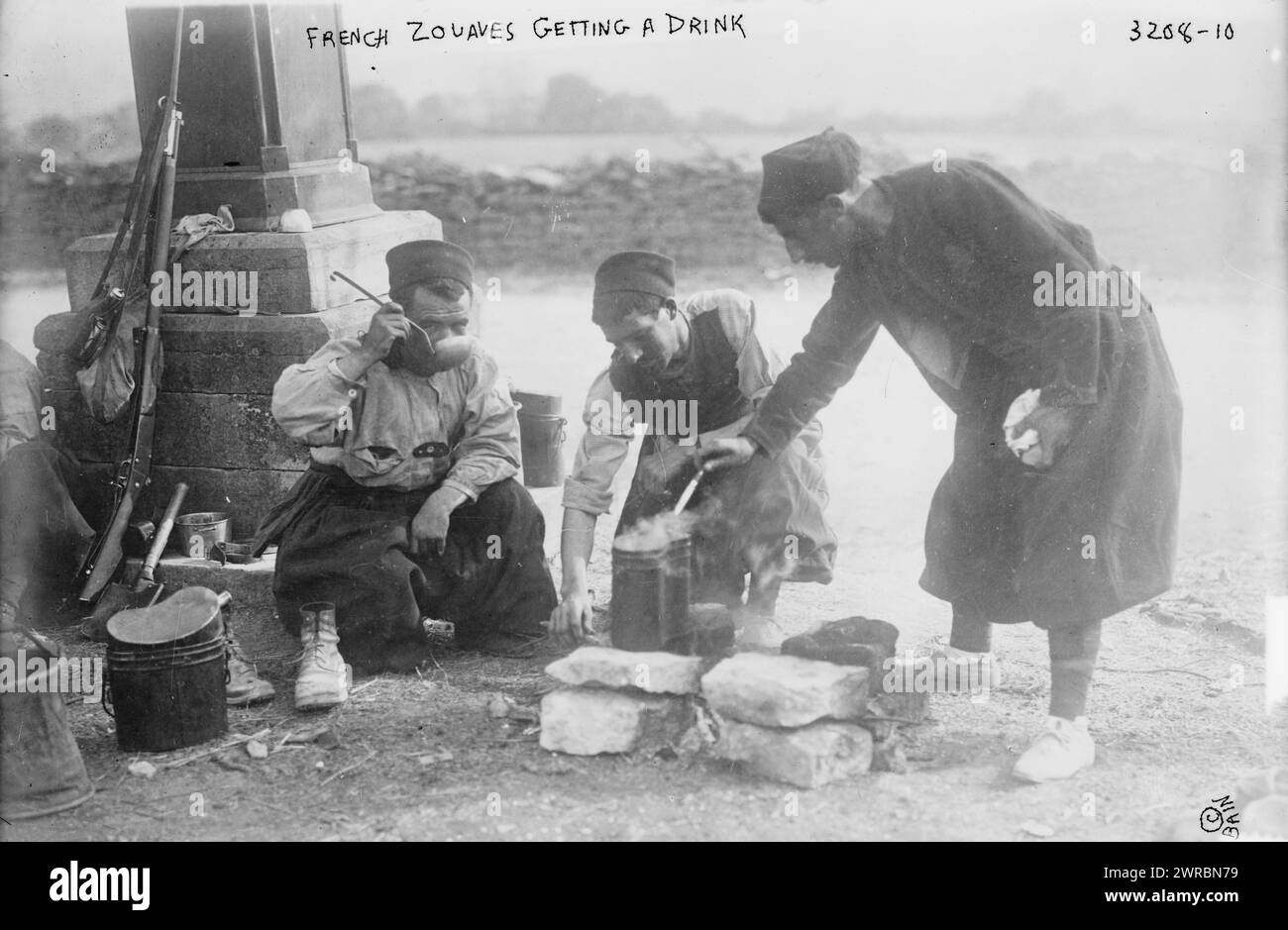 French Zouaves getting a drink, Photograph shows French Zoave soldiers drinking with ladles, during the beginning of World War I., between ca. 1914 and ca. 1915, World War, 1914-1918, Glass negatives, 1 negative: glass Stock Photo