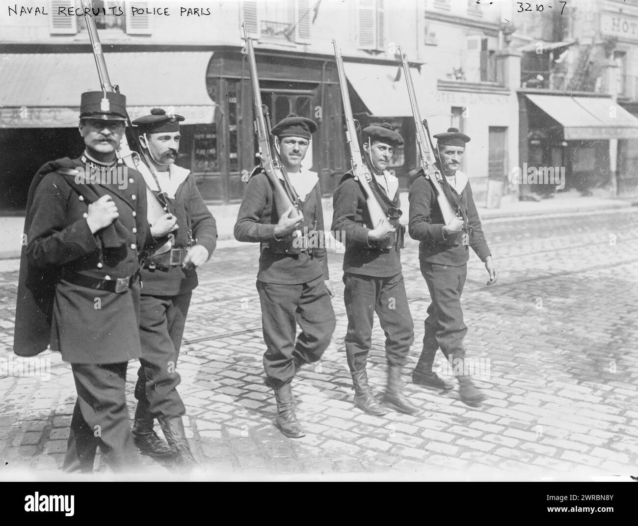 Naval recruits police, Paris, Photograph shows French naval recruits with a police officer, Paris, France, at the beginning of World War I., between ca. 1914 and ca. 1915, World War, 1914-1918, Glass negatives, 1 negative: glass Stock Photo