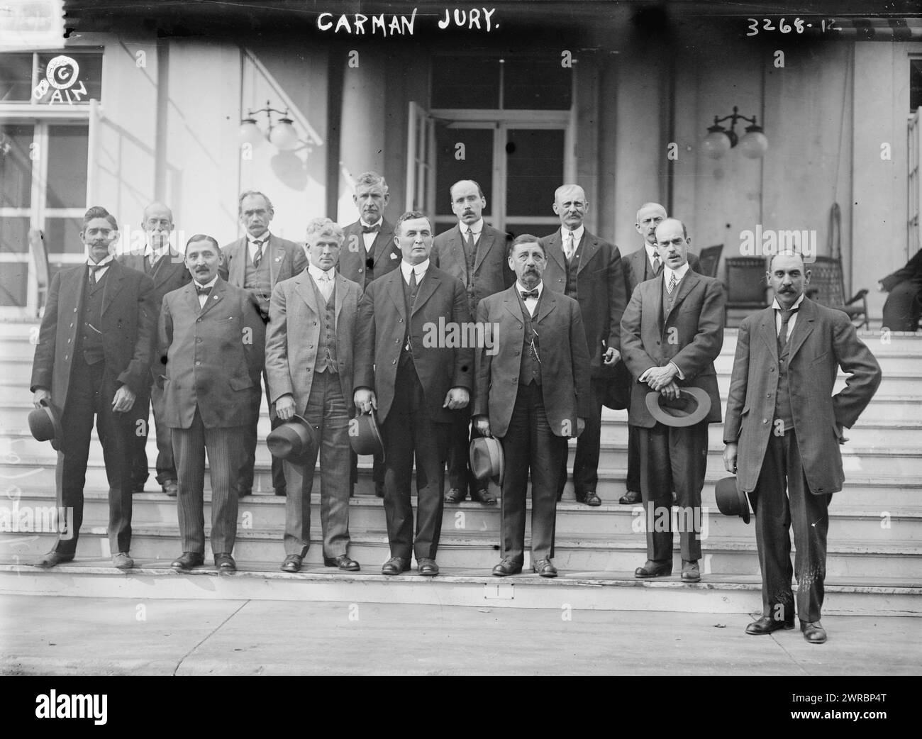 Carman jury, Photograph shows the members of the jury in the 1914 trial of Mrs. Florence Conklin Carman for the murder of Lulu Bailey. Jury included the foreman, Robert F. Ludlam, standing on the left and Alois Angler, Frank D. Mount, William G. Hovey, March Gottsch, Alvin W. Smith, James V.Giraud, Jacob Anton, John H. Molyneaux, Joseph H. Ashton, Eugene E. Carpenter and Charles D. Stryker. Trial was held at the Old Nassau Courthouse, Mineola, Long Island, New York., 1914, Glass negatives, 1 negative: glass Stock Photo