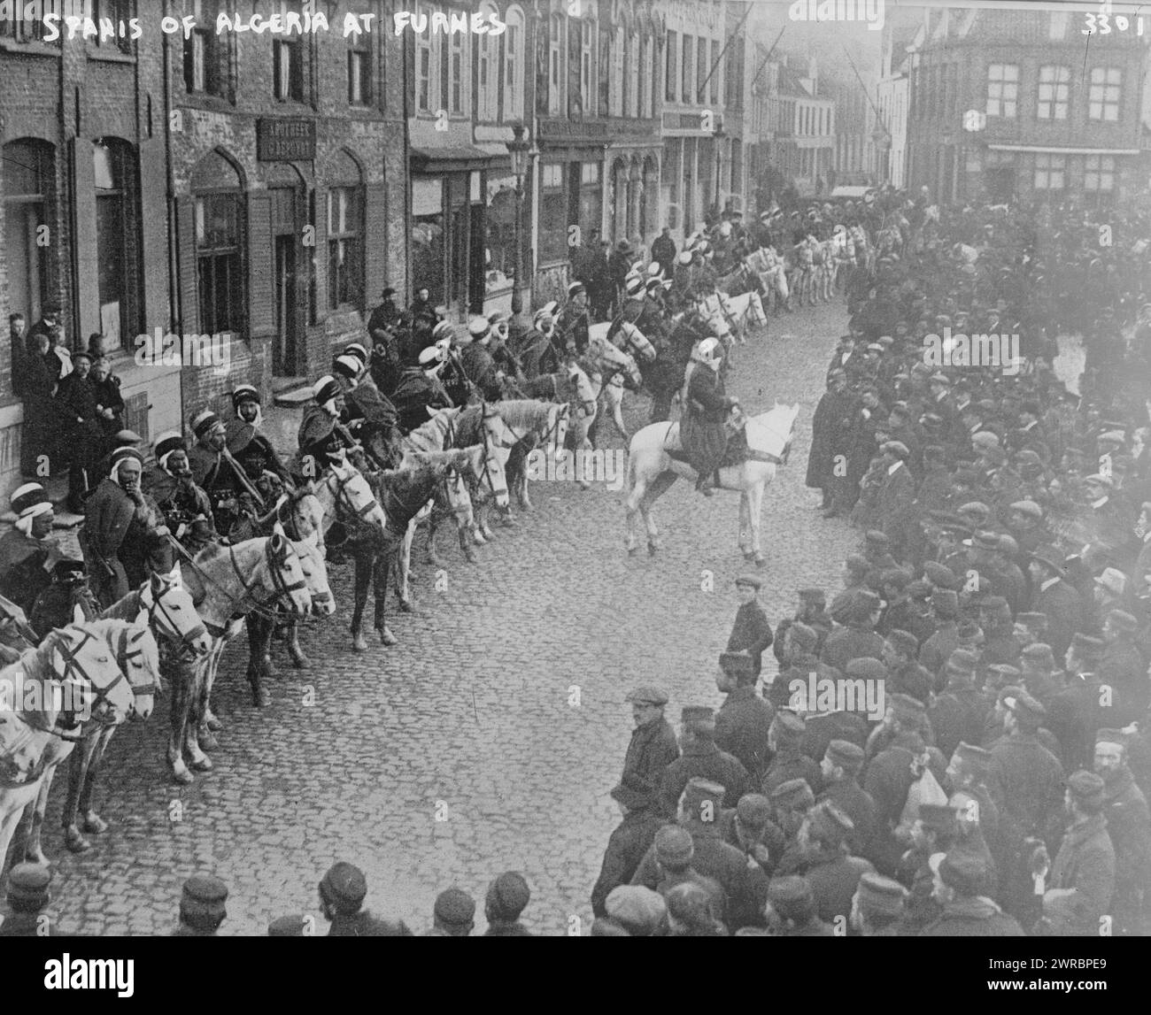 Spahis of Algeria at Furnes, Photograph shows North African troops on horseback in a street, Furnes (Veurne), Belgium during World War I., between ca. 1914 and ca. 1915, World War, 1914-1918, Glass negatives, 1 negative: glass Stock Photo