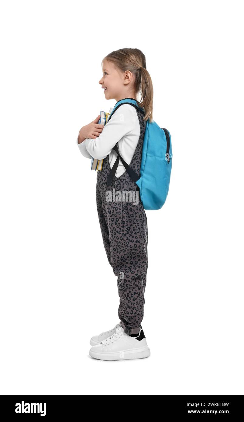 Cute schoolgirl with books on white background Stock Photo - Alamy
