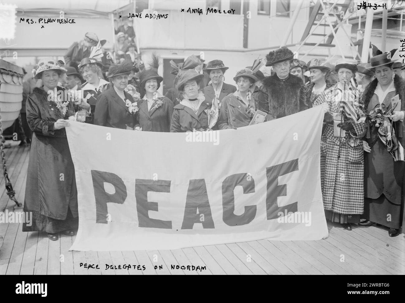 Peace Delegates on NOORDAM, Mrs. P. Lawrence, Jane Addams, Anna Molloy, Photograph shows the American delegates to the International Congress of Women which was held at the Hague, the Netherlands in 1915. The delegates include: feminist and peace activist Emmeline Pethick-Lawrence (1867-1954), social activist and writer Jane Addams (1860-1935), and Annie E. Malloy, president of the Boston Telephone Operators Union. To the right of Malloy may be labor journalist and activist Mary Heaton Vorst (1874-1966) and the woman wearing a hat on the far right may be Lillian Kohlhamer of Chicago. Stock Photo