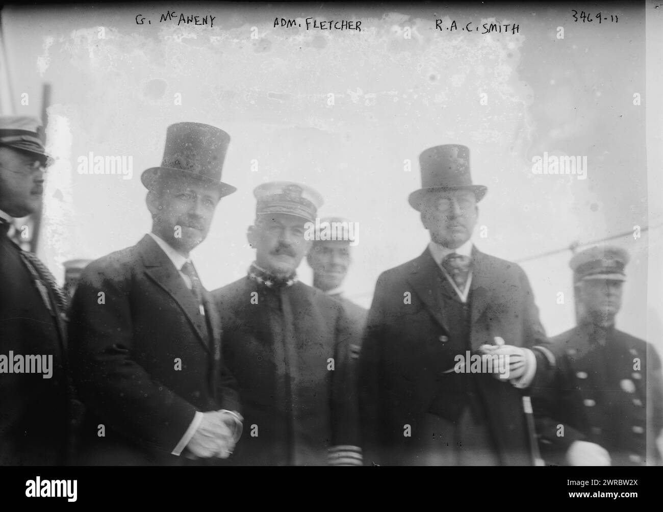 G. McAneny, Adm. Fletcher, R.A.C. Smith, Photograph shows U.S. Navy Admiral Frank Friday Fletcher (1855-1928), Commander of the Atlantic fleet; Robert A.C. Smith (1857-1933), Commissioner of Docks in New York City and Acting Mayor of New York George Francis McAneny (1869-1953). The men were probably gathered on the USS Wyoming for the Naval review of May, 1915., 1915 May, Glass negatives, 1 negative: glass Stock Photo