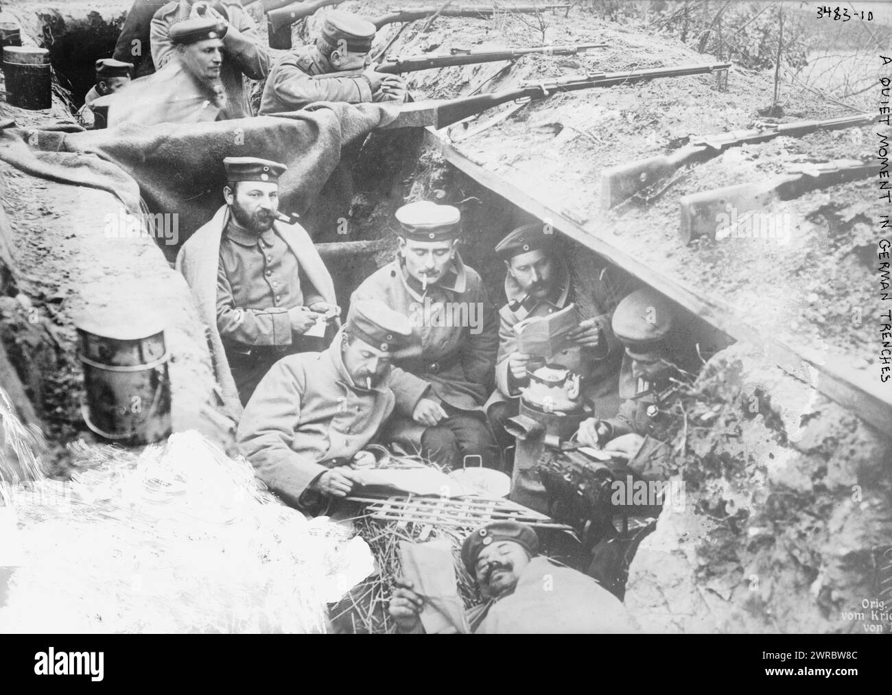 A quiet moment in German trenches, Photograph shows German soldiers smoking and reading in a trench in Flanders, Belgium, during World War I., between 1914 and ca. 1915, World War, 1914-1918, Glass negatives, 1 negative: glass Stock Photo