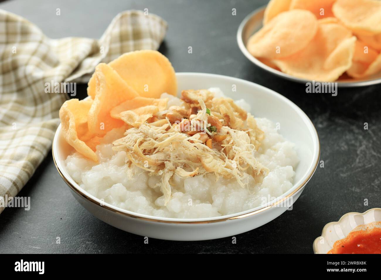 Bubur Ayam or Chicken Porridge, Popular Street Food for Breakfast in Indonesia Stock Photo