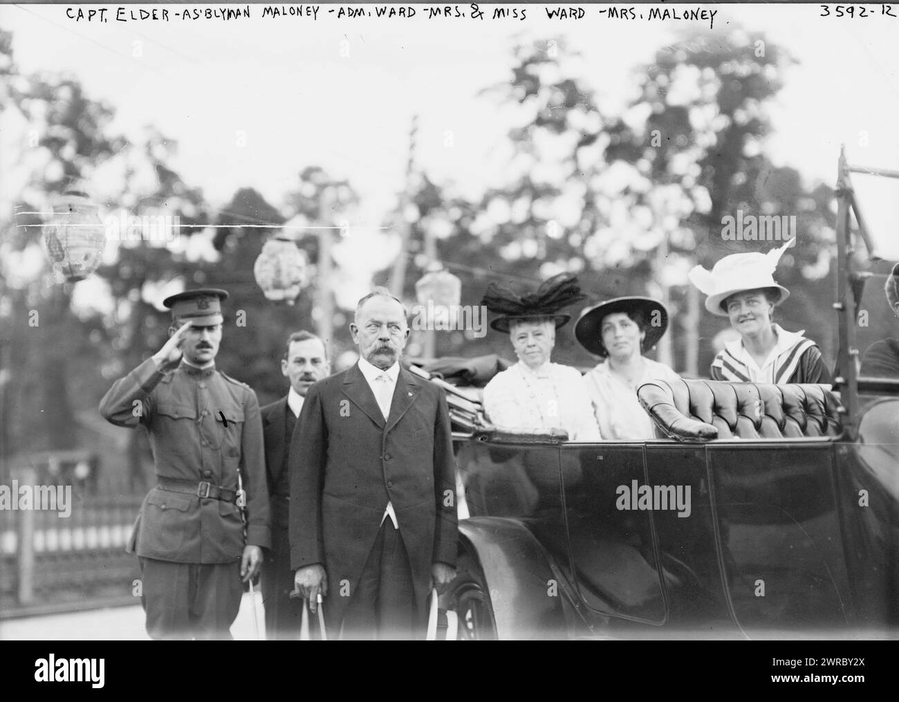 Capt. Elder, As'blyman Maloney, Adm. Ward, Mrs. & Miss Ward, Mrs. Maloney, Photograph shows Thomas B. Maloney, a New York Assemblyman from Nassau County, Long Island, with U.S. Navy Rear Admiral Aaron Ward (1851-1918), his wife, Annie Cairns Willis Ward, and daughter, Hilda Ward (d. 1950). The gathering probably took place on Labor Day, 1915 in Great Neck, Long Island., 1915, Glass negatives, 1 negative: glass Stock Photo