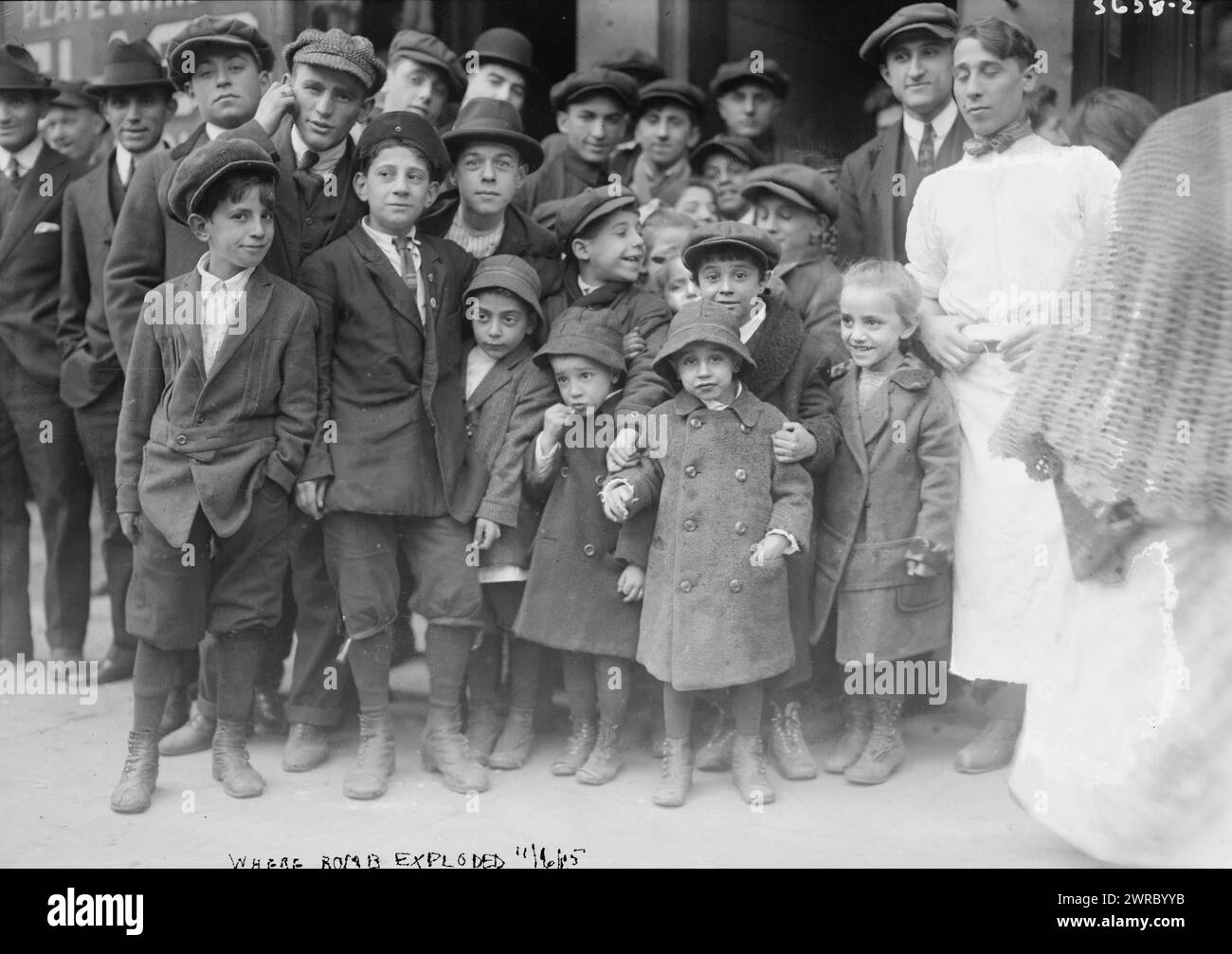 Where bomb exploded, Photograph shows a crowd gathering after the bombing of the Italian Consulate at 226 Lafayette St, on Cleveland Place in Little Italy, New York City on November 5, 1915., 1915 Nov. 6, Glass negatives, 1 negative: glass Stock Photo