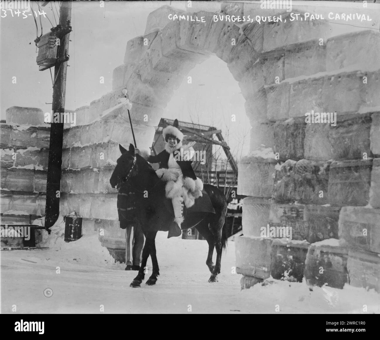 Camille Burgess, Queen, St. Paul Carnival, Photograph shows Miss Camille Burgess, Queen of the St. Paul Outdoor Sports Carnival giong into the ice fort on Harriet Island under an ice block arch, St. Paul, Minnesota., 1916, Glass negatives, 1 negative: glass Stock Photo