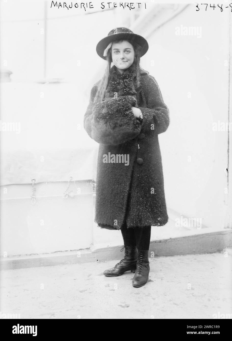 Marjorie Sterrett, Photograph shows Marjorie Sterrett who sent a dime to build a battleship. She was greeted by Theodore Roosevelt on the Steamship Guiana, February 11, 1916., between ca. 1915 and ca. 1920, Glass negatives, 1 negative: glass Stock Photo
