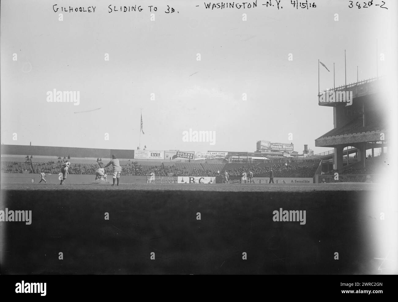 Frank Gilhooley, New York AL, sliding into third base vs. Washington AL (baseball), 1916 Apr. 15., Glass negatives, 1 negative: glass Stock Photo