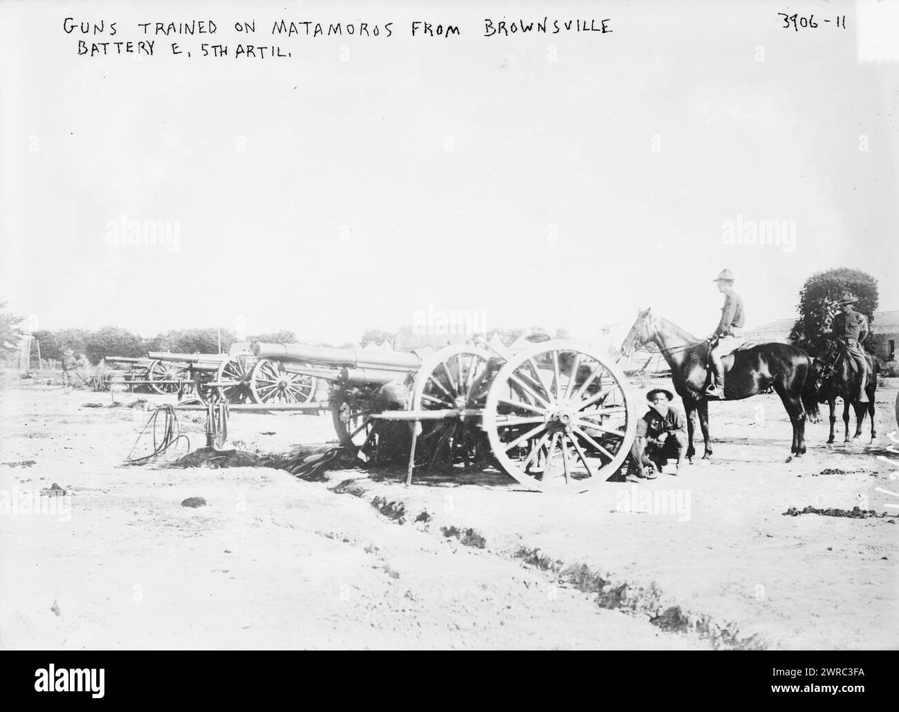 Guns trained on Matamoros from Brownsville Battery E. 5th Artil., Photograph shows Battery E of the 6th Field Artillery at Fort Brown, Texas, June 1916., 1916 June, Glass negatives, 1 negative: glass Stock Photo