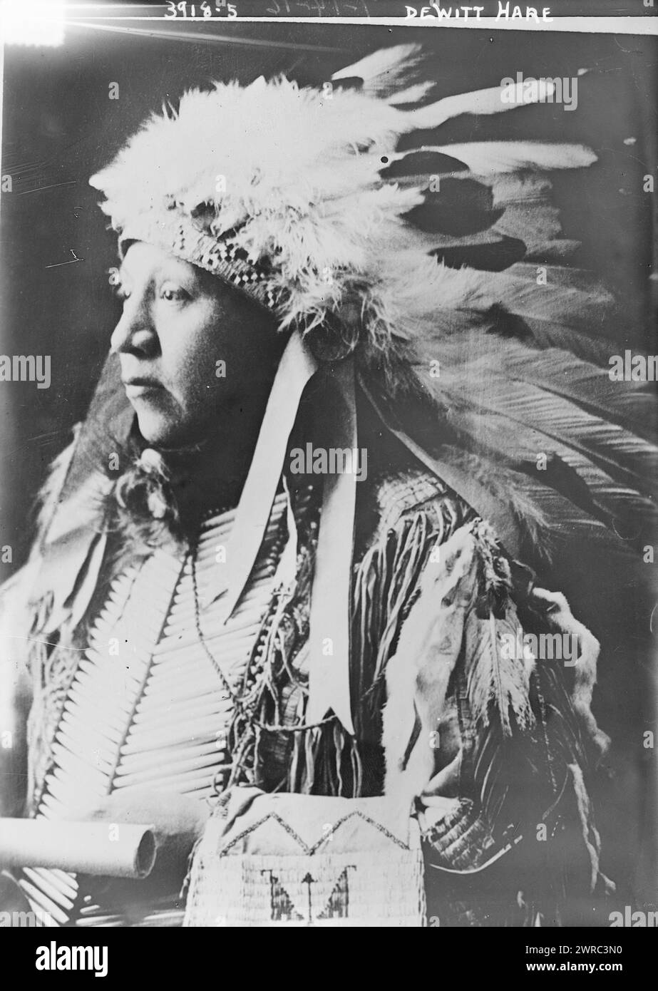 Dewitt Hare In American Indian headdress, between ca. 1915 and ca. 1920, Glass negatives, 1 negative: glass Stock Photo
