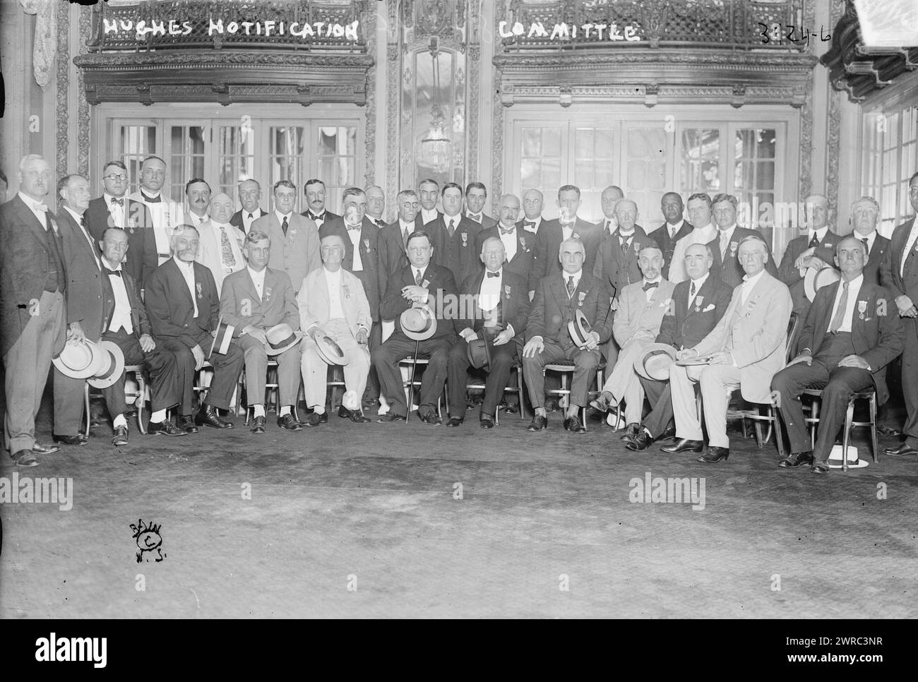 Hughes Notification Committee, Photograph shows the committee of Republicans gathered in New York to select their presidential candidate. Ohio Senator Warren G. Harding is seated at center right holding hat., 1916 July, Glass negatives, 1 negative: glass Stock Photo
