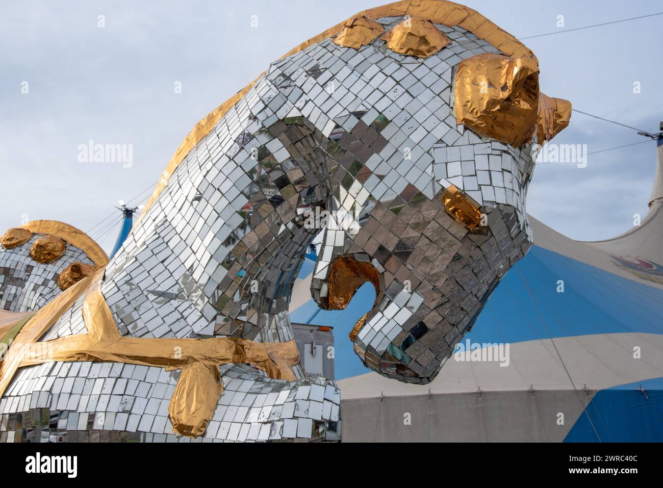 Gold and silver mirrored surface on horse statue in front of big top tent for Circus Vazquez, McAllen, Hidalgo County, Texas, USA. Stock Photo